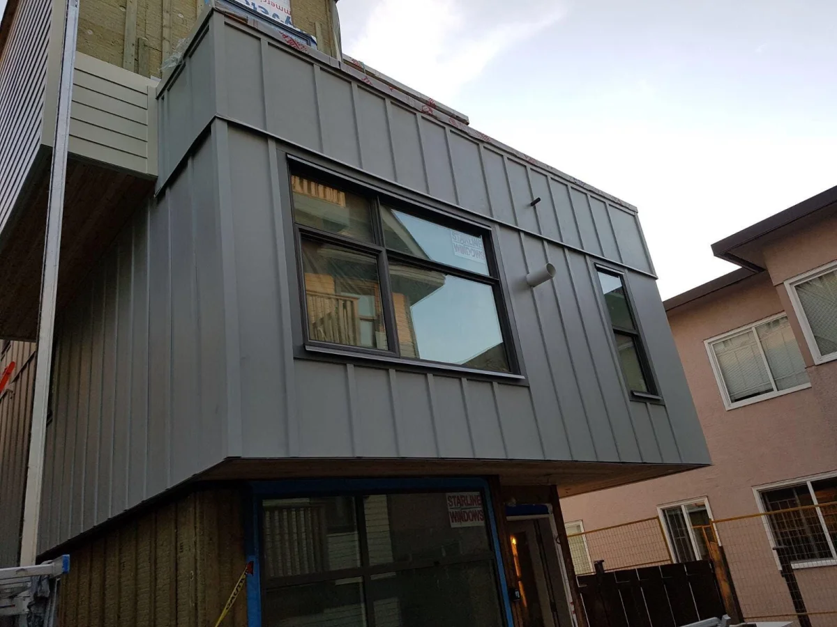 Standing seam metal cladding and Starline Windows on two-storey addition in Vancouver