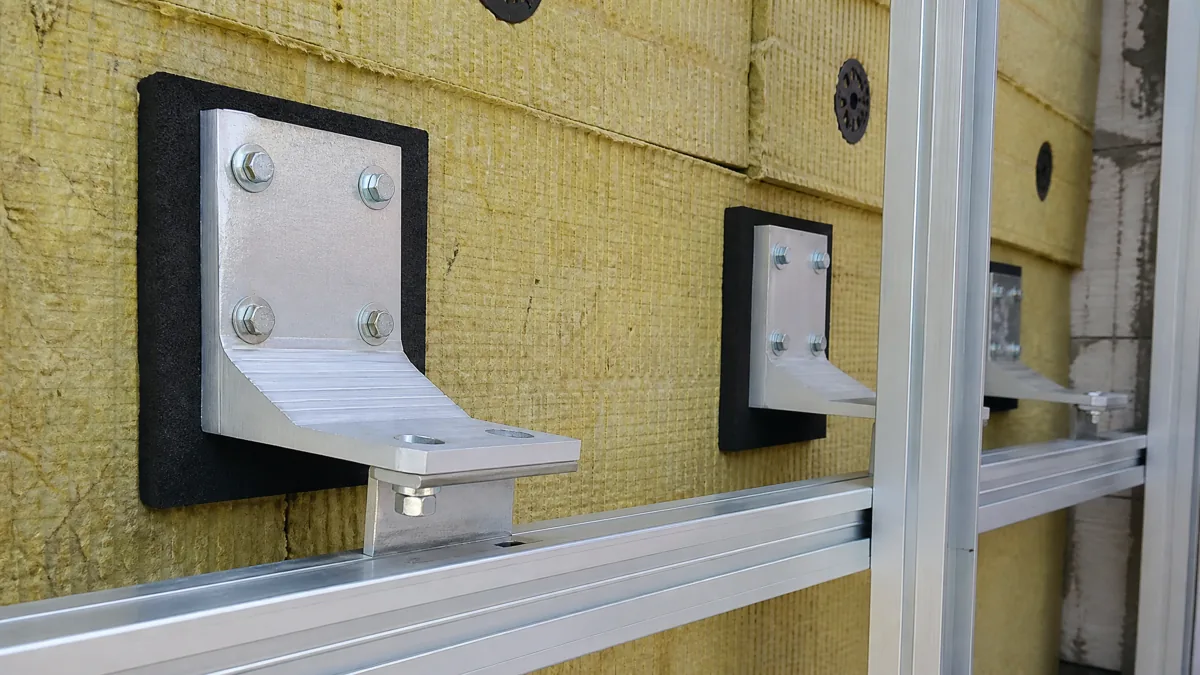 Aluminum thermal-break bracket and rail system supporting rainscreen cladding in Vancouver